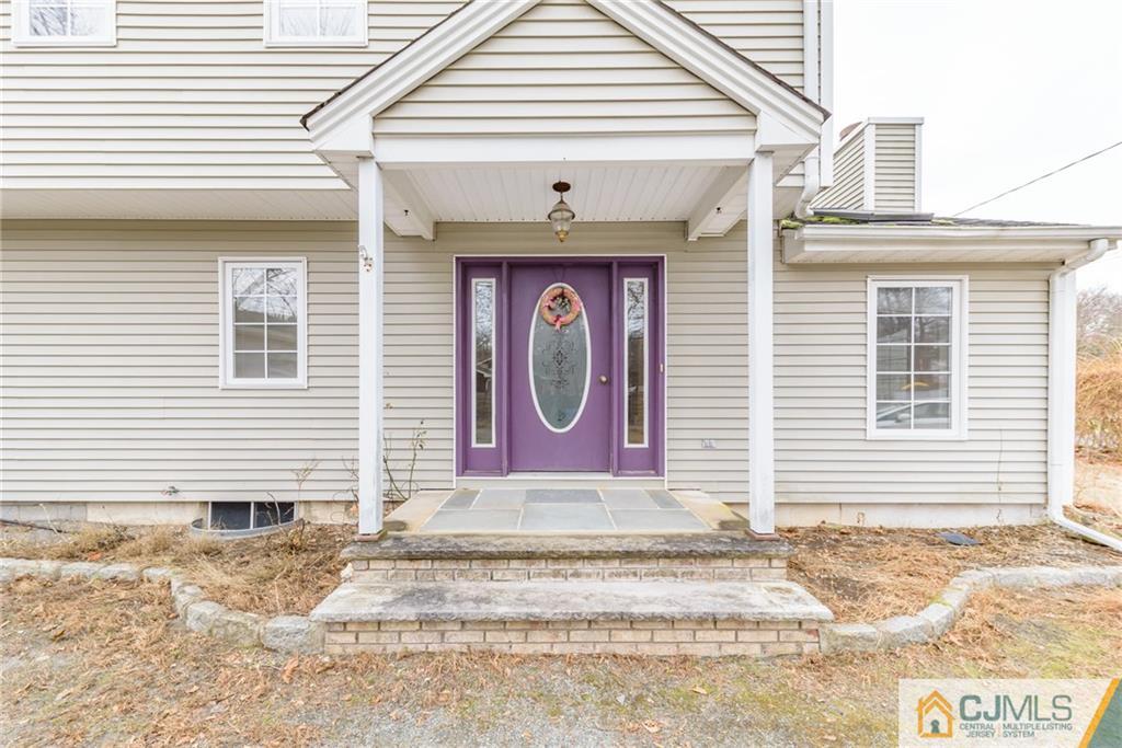 26 Moquis Trail Oak Ridge, NJ 07438 - Photo 3 of 23 a front view of a house
