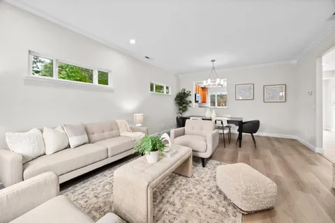 a living room with furniture and a rug