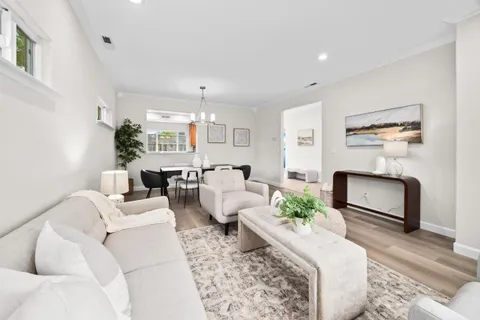 a living room with furniture fireplace and a flat screen tv