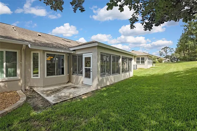a view of a house with backyard porch and garden