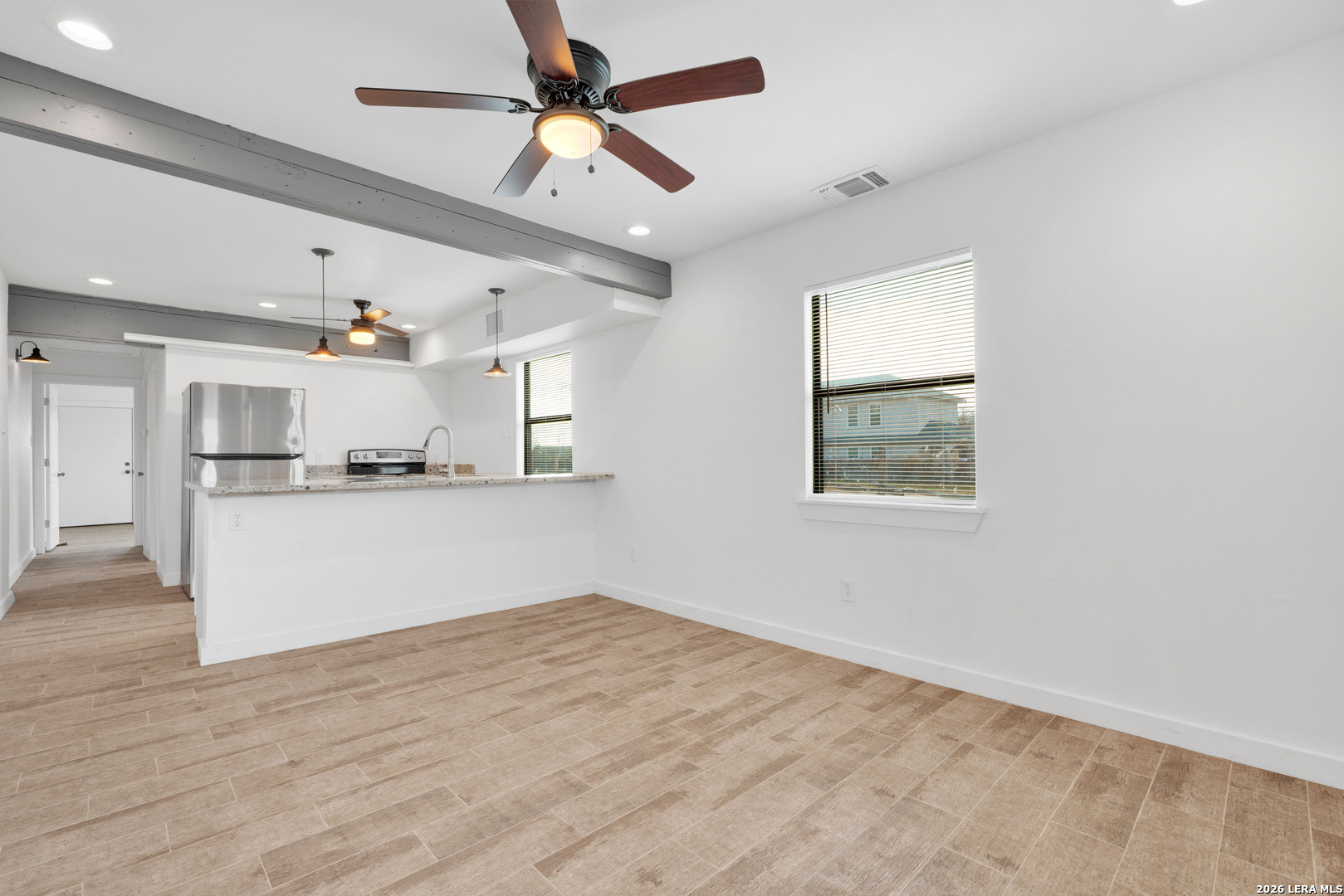 18460 Interstate 37 Elmendorf, TX 78112 - Photo 19 of 28 a view of kitchen with refrigerator and window
