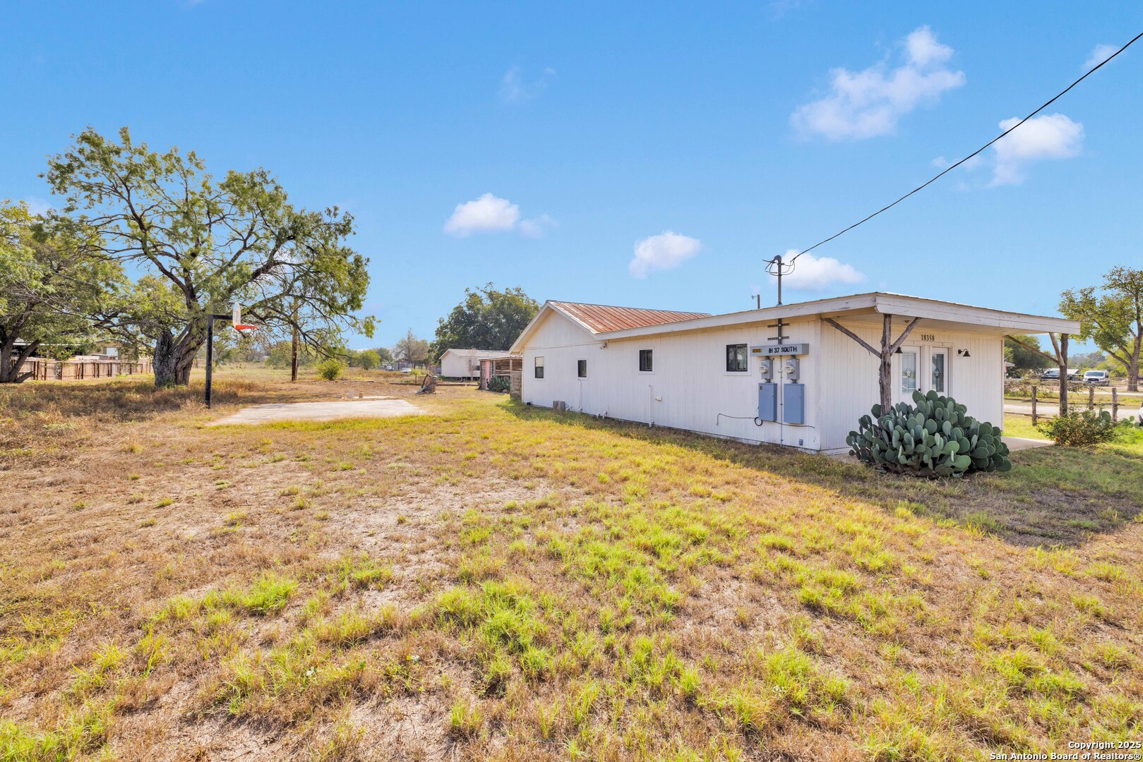 18460 Interstate 37 Elmendorf, TX 78112 - Photo 4 of 28 a view of a swimming pool with an outdoor space