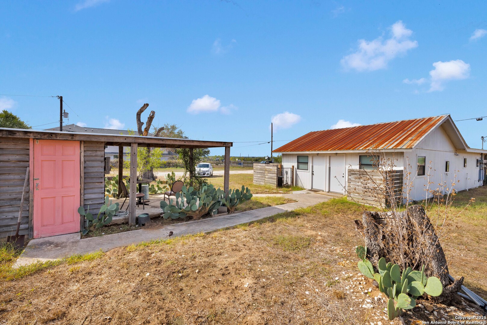 18460 Interstate 37 Elmendorf, TX 78112 - Photo 7 of 28 a view of a house with backyard and sitting area