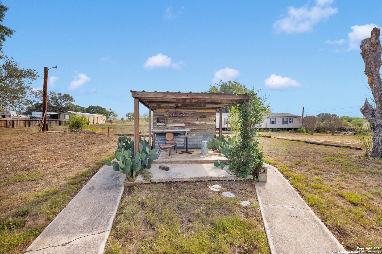 18460 Interstate 37 Elmendorf, TX 78112 - Photo 8 of 28 a view of a lake and front yard