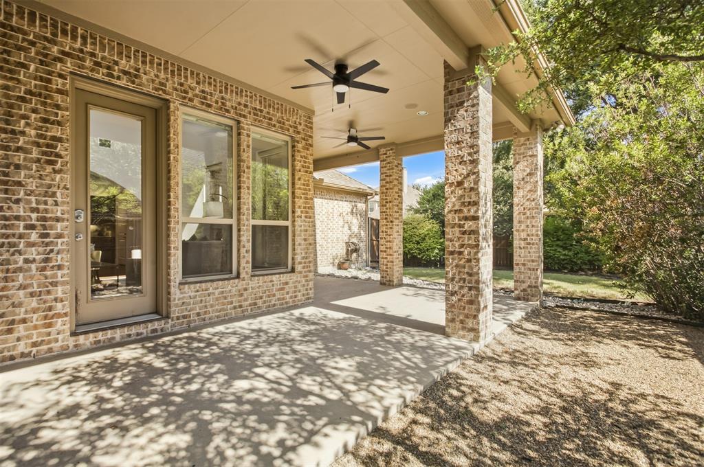 846 Deerfield Road Allen, TX 75013 - Photo 35 of 40 Covered patio with brick columns, concrete flooring, and multiple ceiling fans