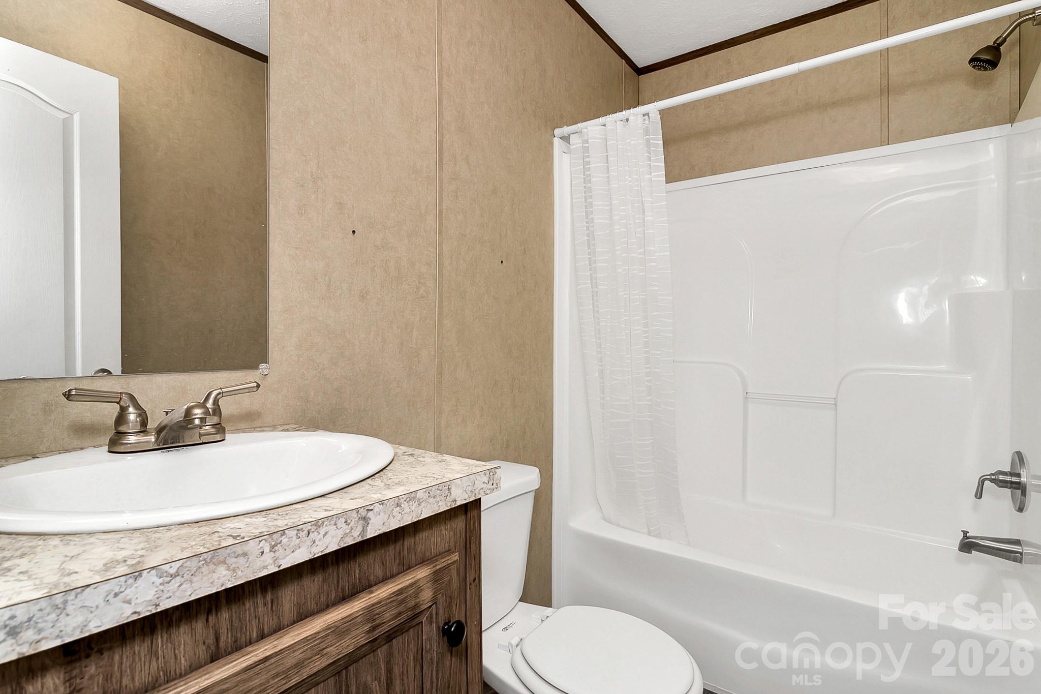 44 Tuttle Road Hendersonville, NC 28792 - Photo 37 of 37 a bathroom with a granite countertop sink toilet and shower