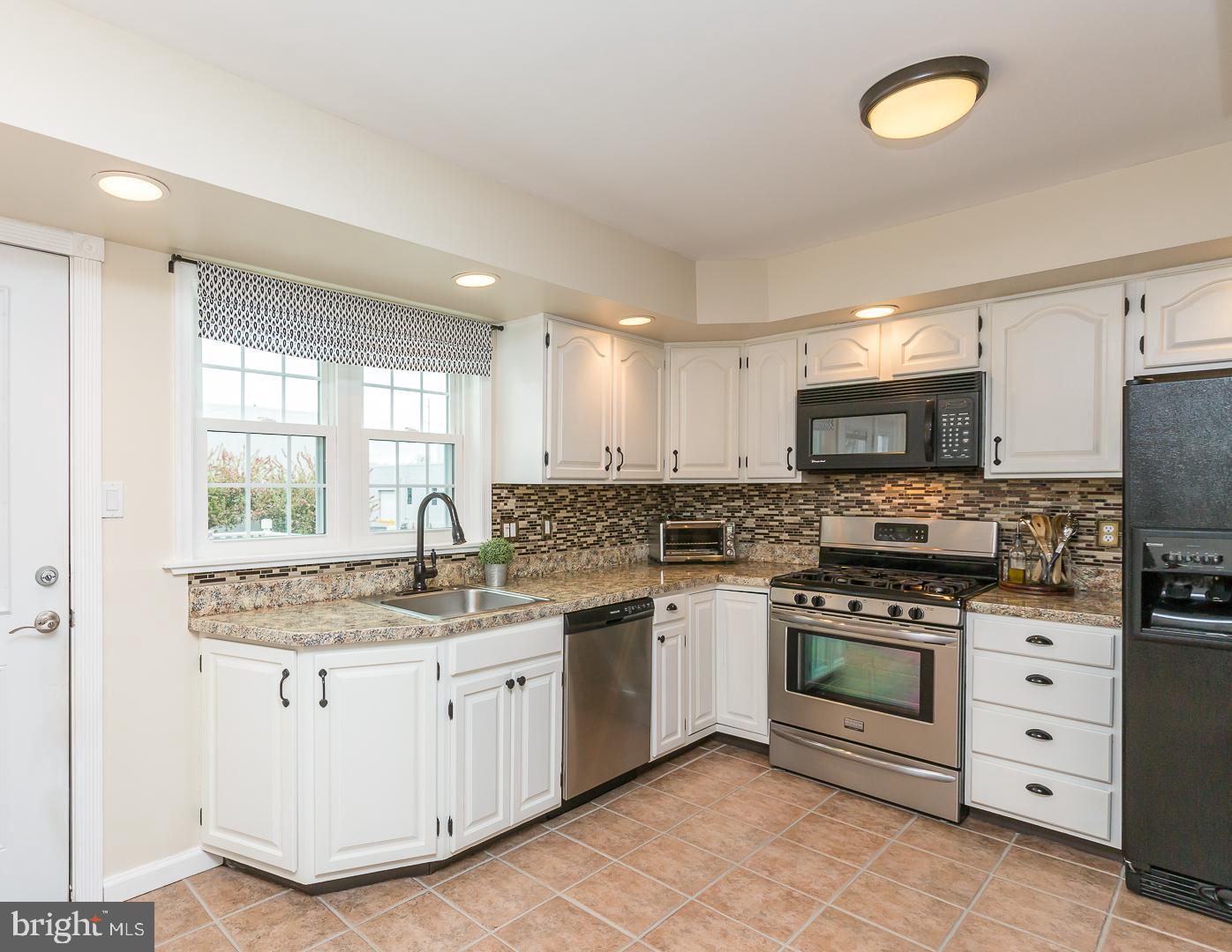1943 Oak Leaf Lane Holmes, PA 19043 - Photo 10 of 38 ceramic tile floor in large kitchen