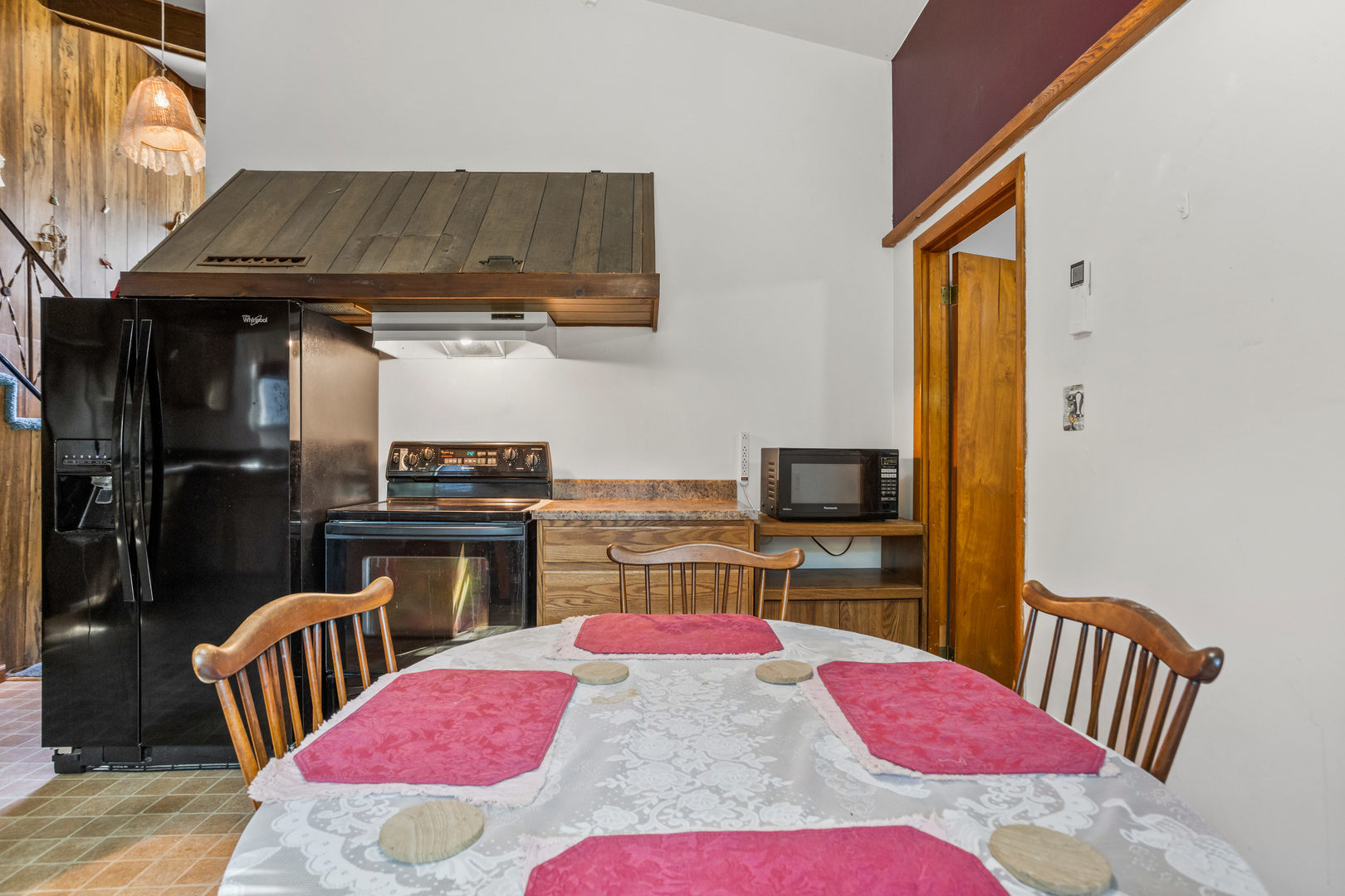 808 South Longview Road Monticello, IL 61856 - Photo 23 of 41 a kitchen with stainless steel appliances kitchen island granite countertop a dining table and chairs with wooden floor
