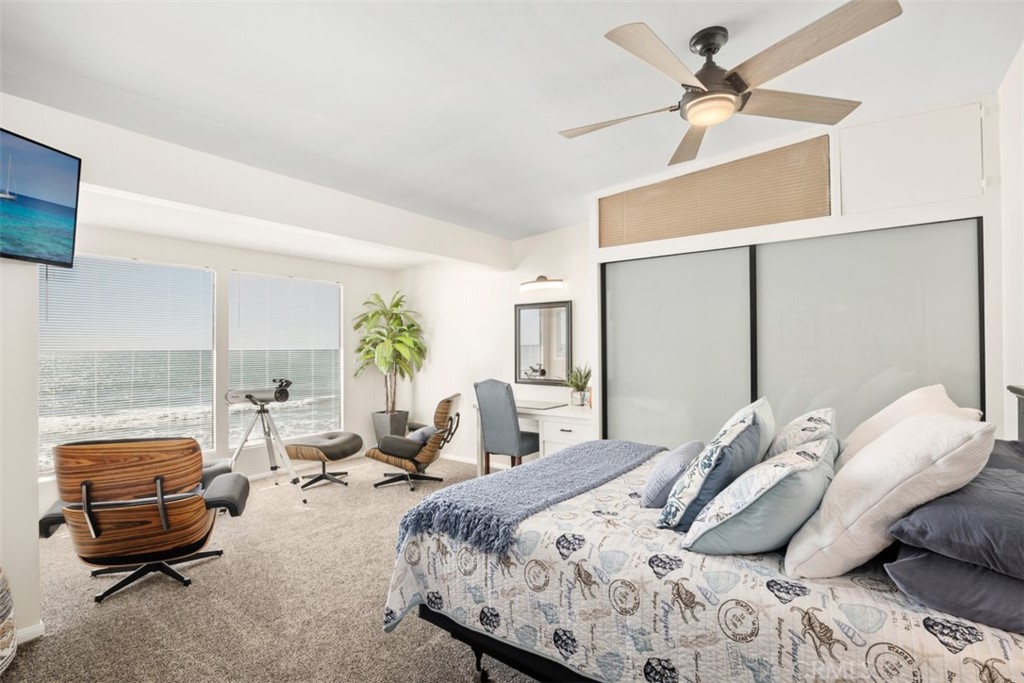 35725 Beach Road Dana Point, CA 92624 - Photo 19 of 40 a bedroom with a bed a couch and a potted plant