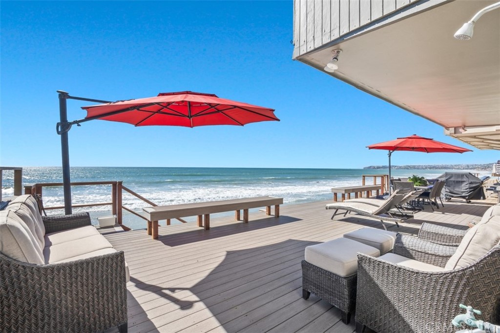 35725 Beach Road Dana Point, CA 92624 - Photo 26 of 40 an outdoor sitting area with furniture and umbrella