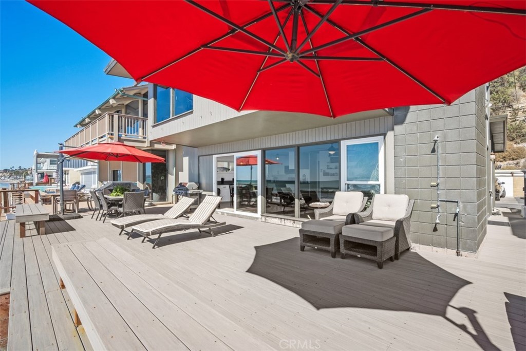 35725 Beach Road Dana Point, CA 92624 - Photo 27 of 40 a view of a patio with chairs and umbrellas