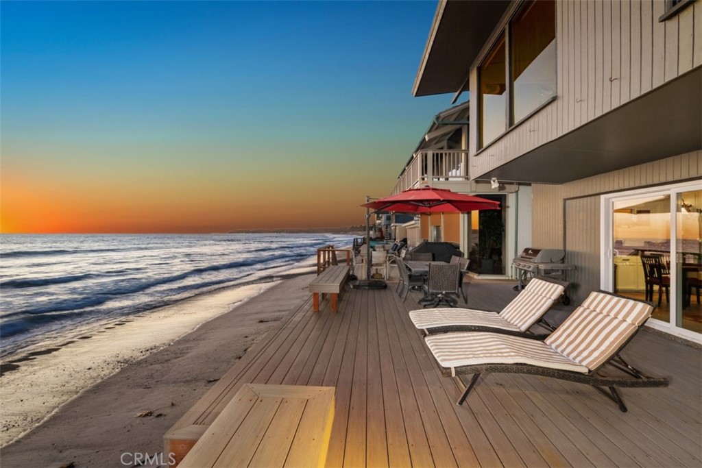 35725 Beach Road Dana Point, CA 92624 - Photo 4 of 40 a view of balcony with chairs and wooden floor