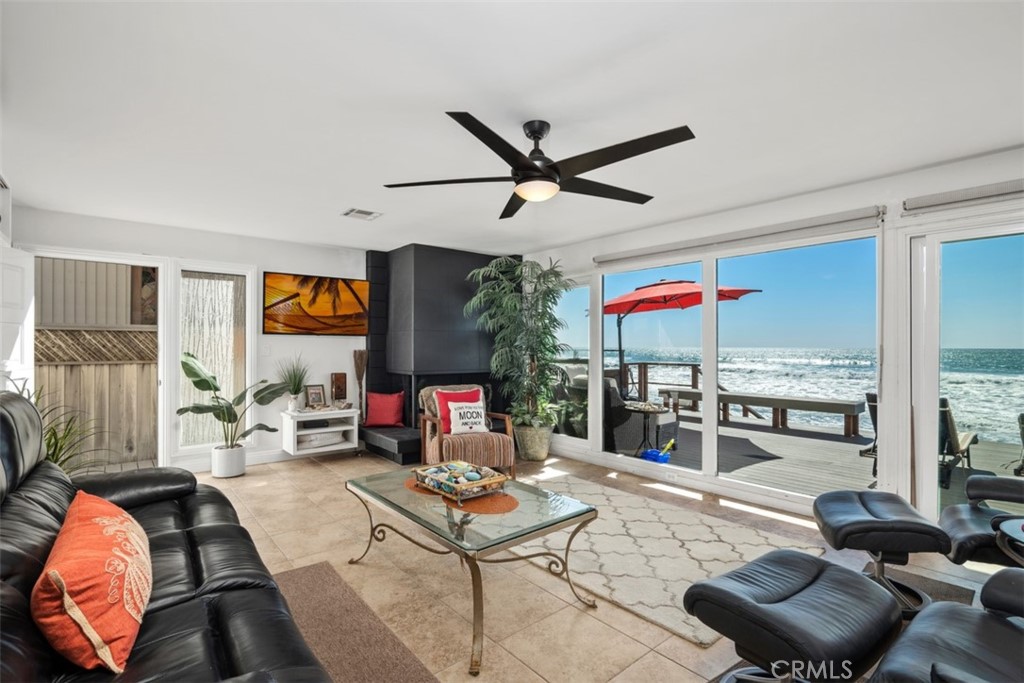 35725 Beach Road Dana Point, CA 92624 - Photo 9 of 40 a living room with furniture and a floor to ceiling window
