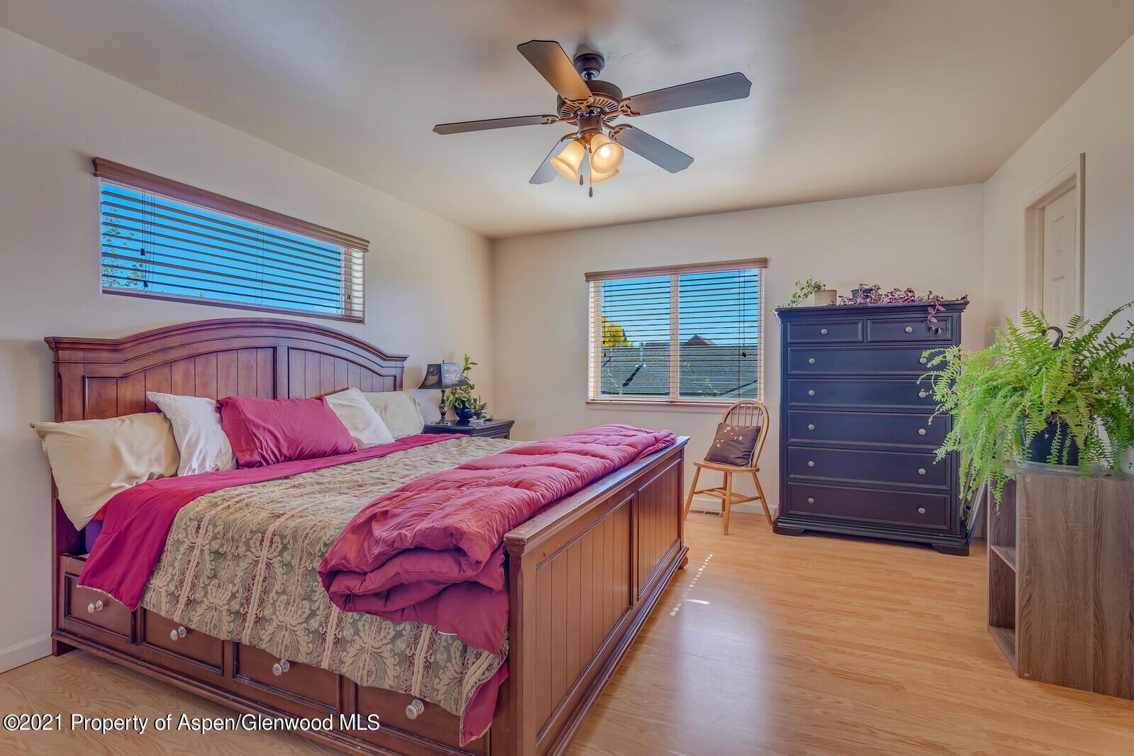 925 East 18th Street Rifle, CO 81650 - Photo 12 of 24 a bedroom with a bed and a dresser
