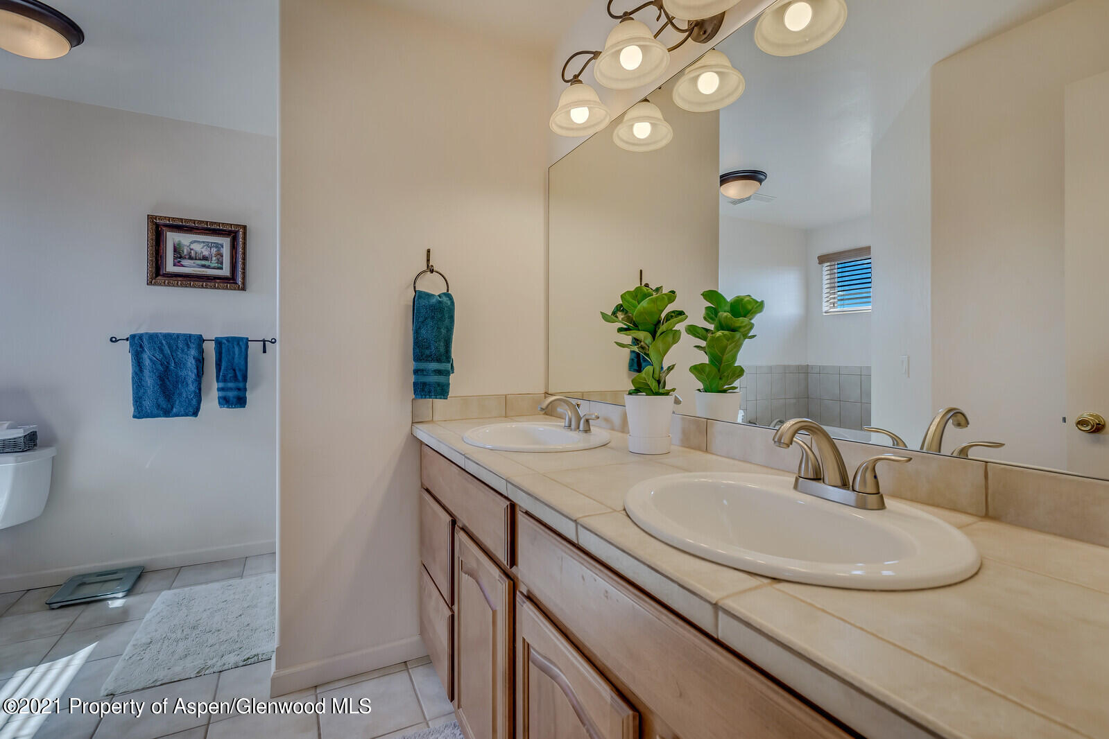 925 East 18th Street Rifle, CO 81650 - Photo 13 of 24 a bathroom with a sink and a mirror