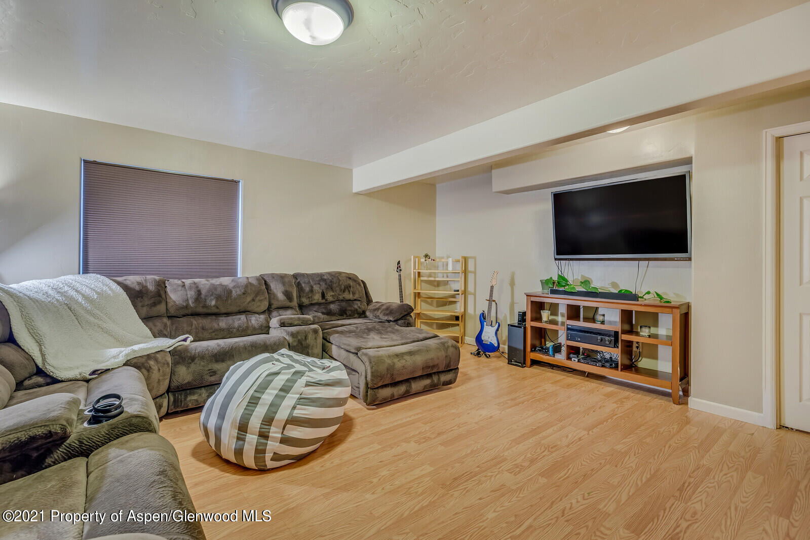 925 East 18th Street Rifle, CO 81650 - Photo 15 of 24 a living room with furniture and a flat screen tv