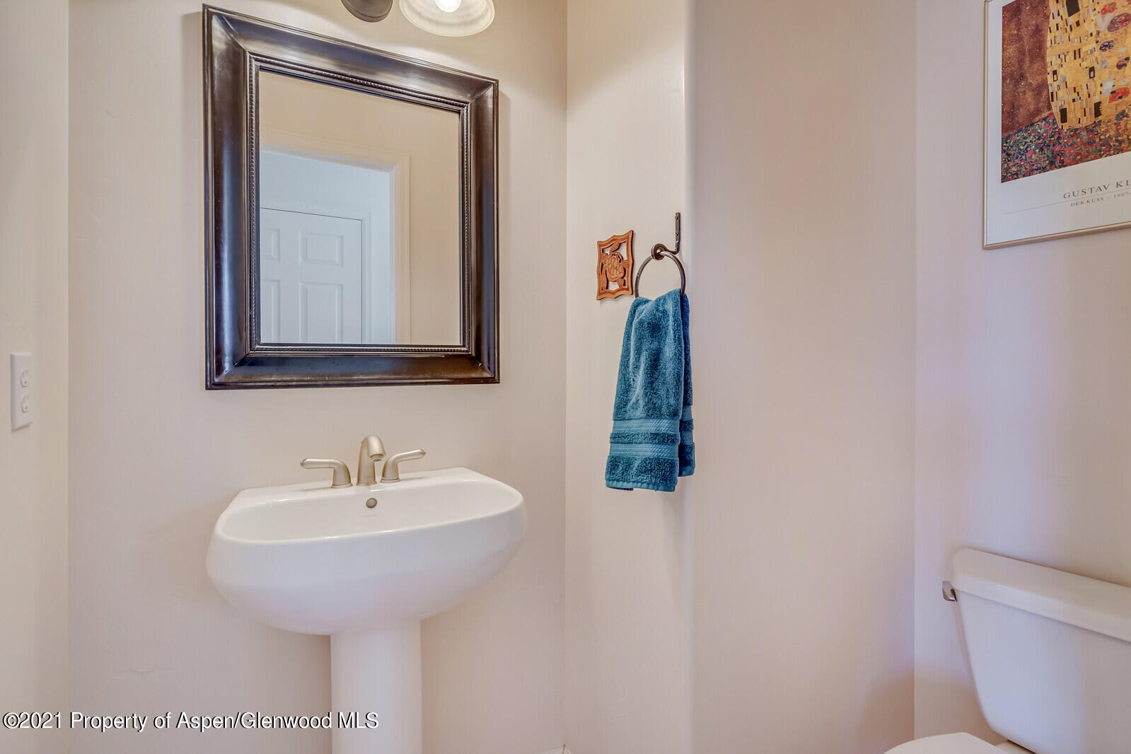 925 East 18th Street Rifle, CO 81650 - Photo 17 of 24 a bathroom with a toilet sink and mirror