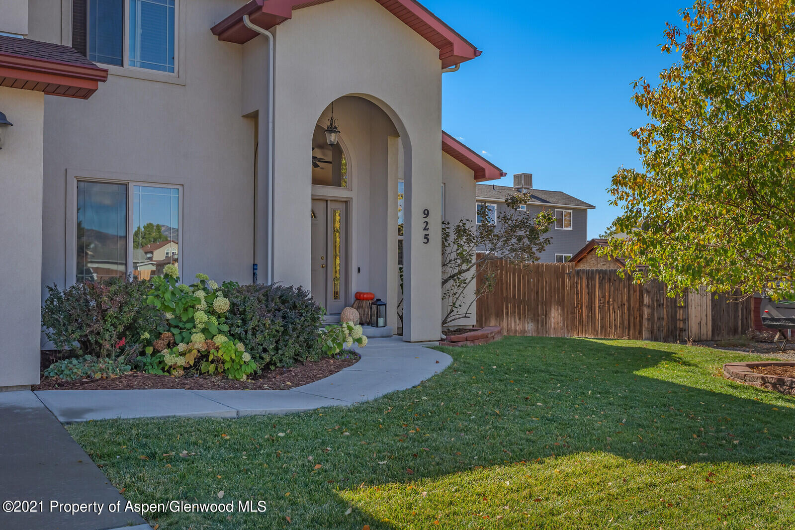 925 East 18th Street Rifle, CO 81650 - Photo 2 of 24 a front view of a house with a garden