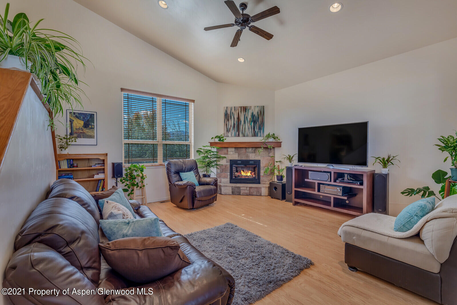 925 East 18th Street Rifle, CO 81650 - Photo 3 of 24 a living room with furniture and a flat screen tv
