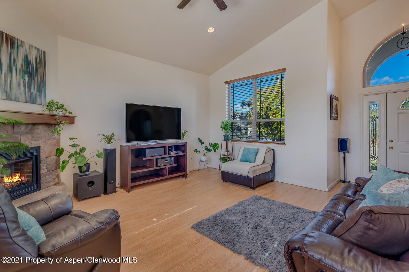 925 East 18th Street Rifle, CO 81650 - Photo 4 of 24 a living room with furniture and a flat screen tv