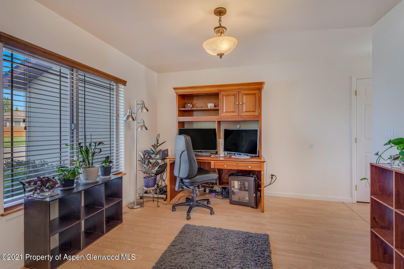 925 East 18th Street Rifle, CO 81650 - Photo 10 of 24 a view of a livingroom with furniture and workspace