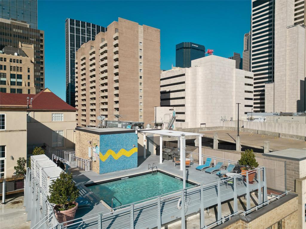 1122 Jackson Street, Unit 301 Dallas, TX 75202 - Photo 22 of 23 a view of building with balcony and outdoor seating