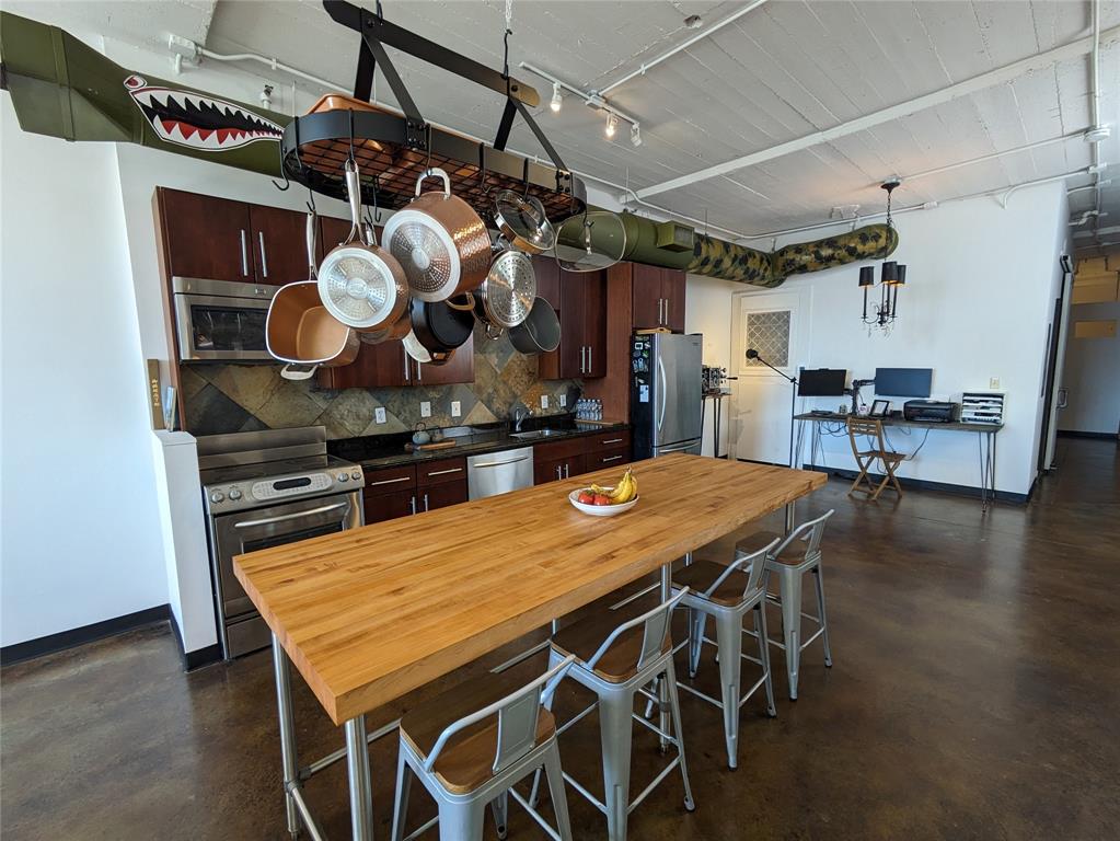 1122 Jackson Street, Unit 301 Dallas, TX 75202 - Photo 9 of 23 a view of a table and chairs in a room
