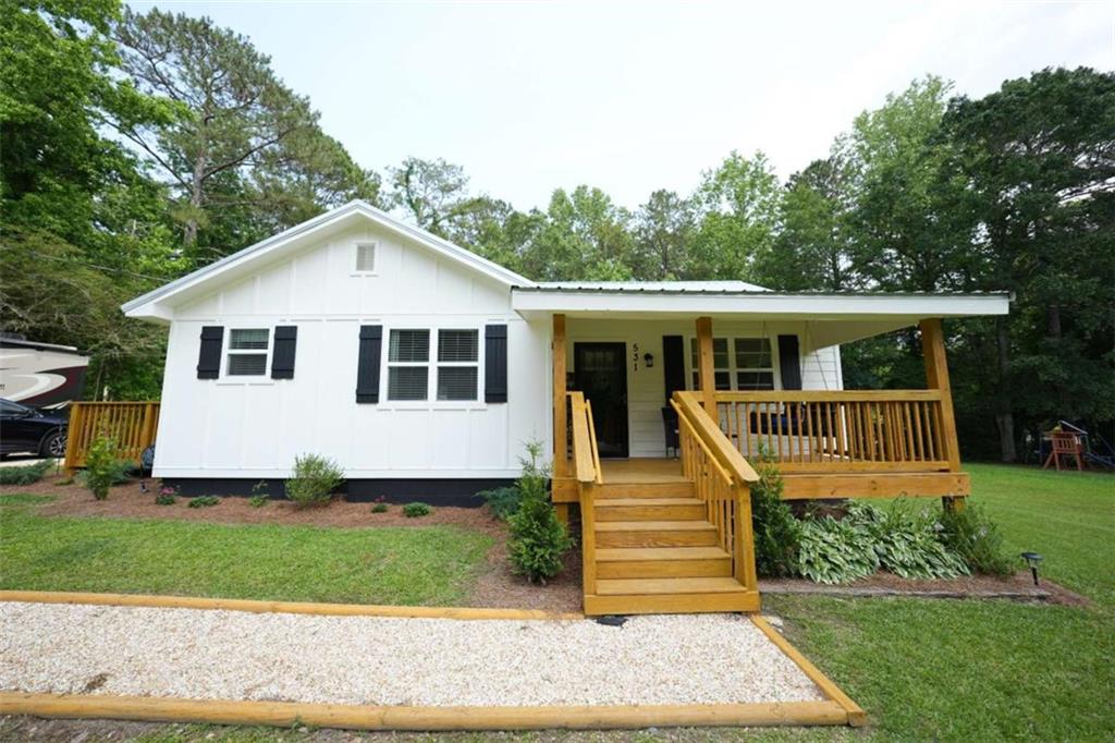 531 Beaverpond Road Carrollton, GA 30117 - Photo 1 of 1 a front view of a house with a yard