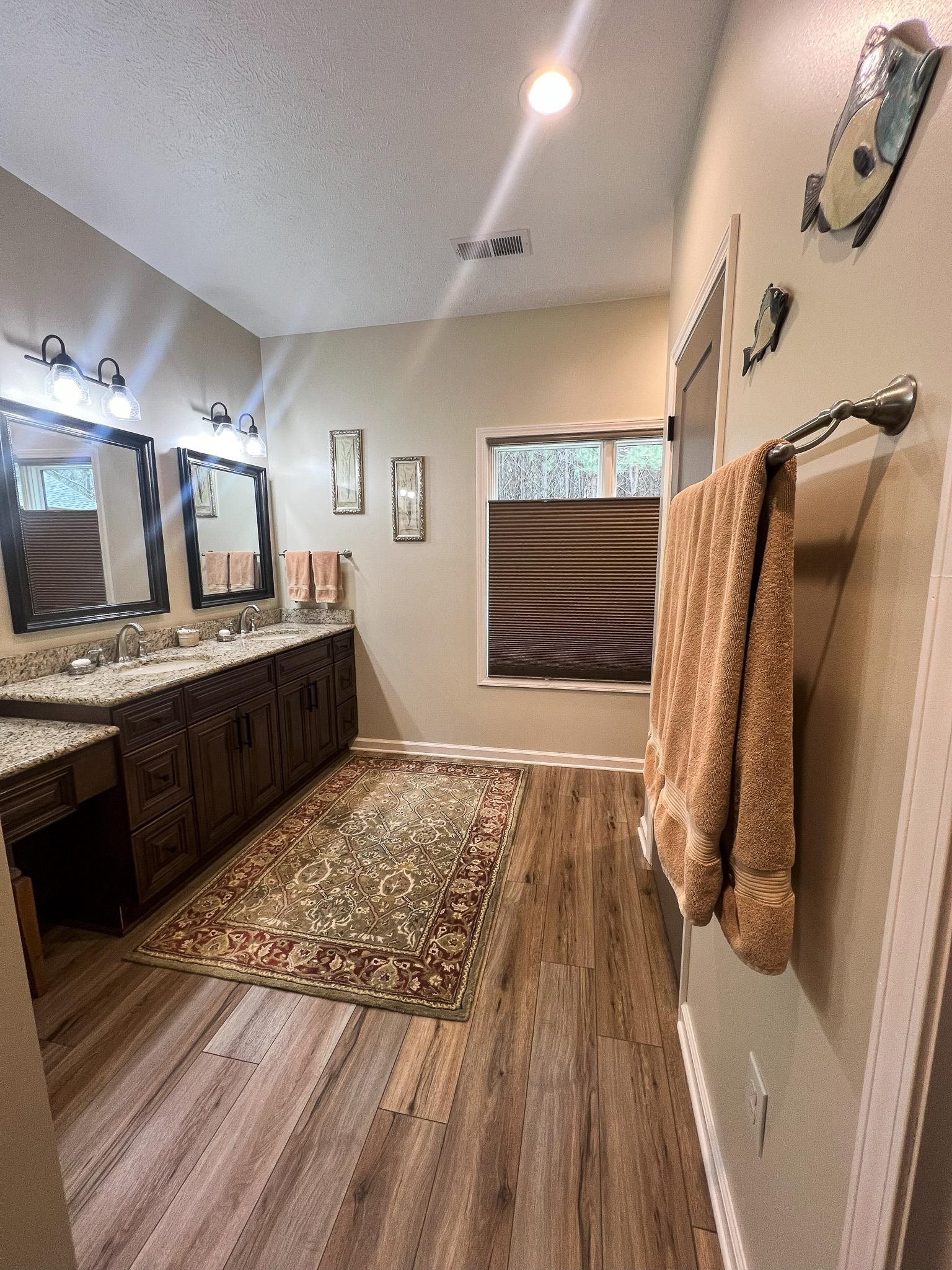 1231 Murray School Road Selmer, TN 38375 - Photo 16 of 39 Bathroom with hardwood / wood-style floors and vanity