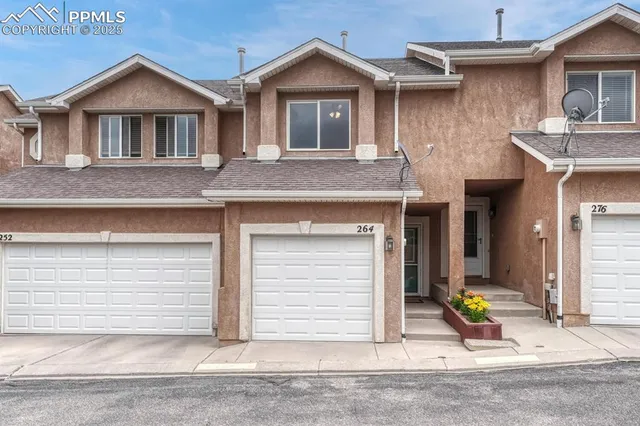 a view of a house with wooden walls