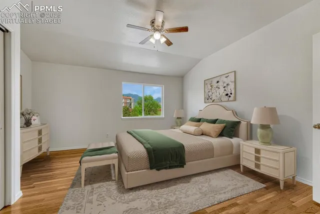 a bedroom with a bed and a table