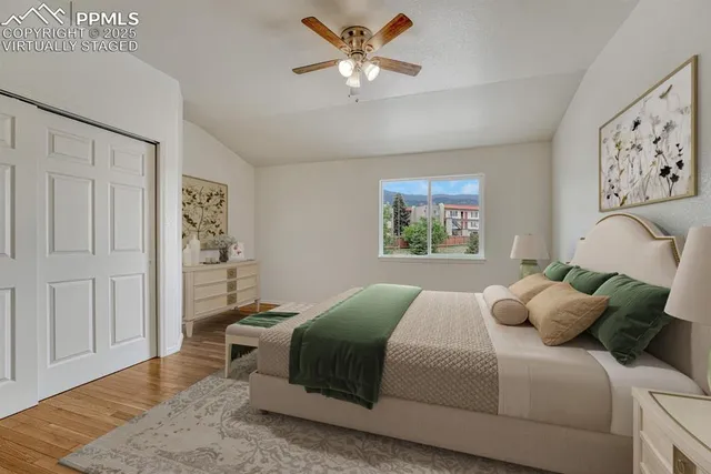 a bedroom with a large bed and a window
