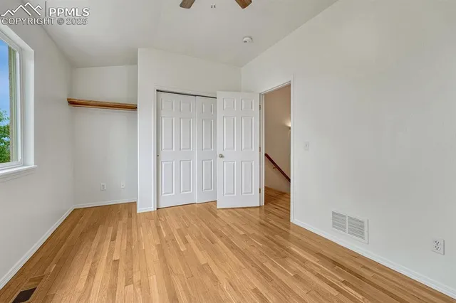 a view of a room with wooden floor and small space
