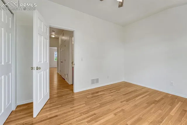 a view of a room with wooden floor
