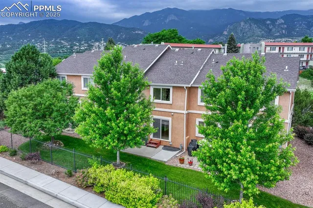an aerial view of a house with a garden