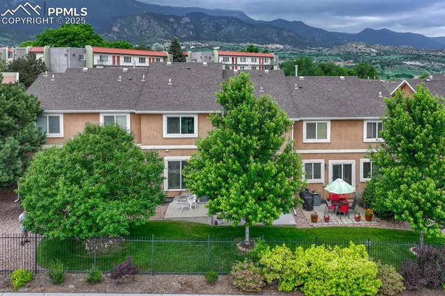 an aerial view of a house with a yard and a garden