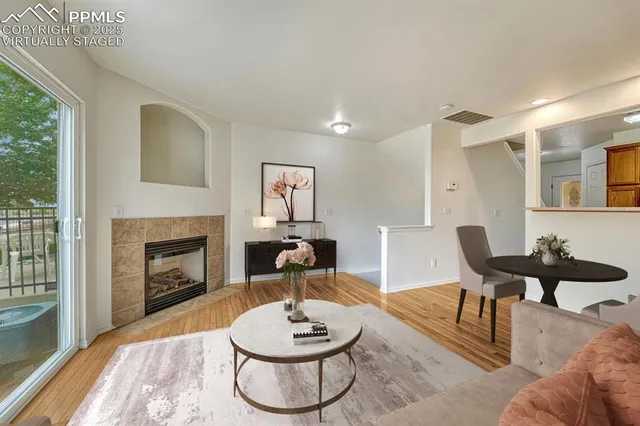 a living room with furniture and a fireplace