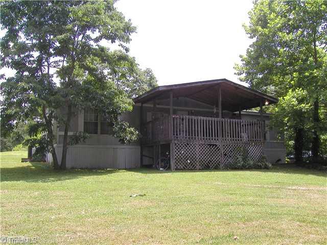 445 Bell Branch Road Mocksville, NC 27028 - Photo 13 of 15 Exterior Front. Front of deck and manufactured home on property being sold "as is"