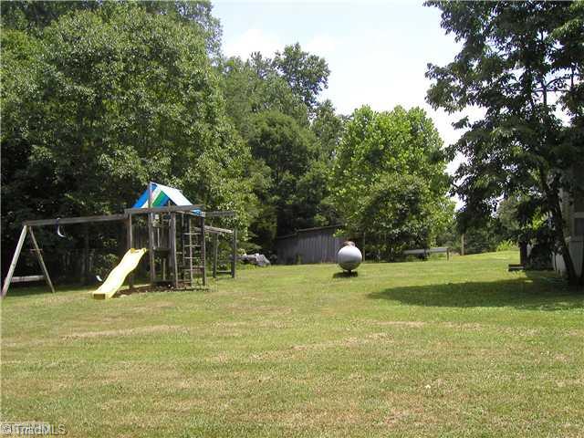 445 Bell Branch Road Mocksville, NC 27028 - Photo 15 of 15 Land. Play area beside of manufactured home
