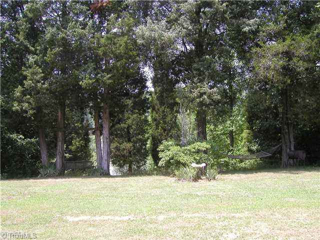 445 Bell Branch Road Mocksville, NC 27028 - Photo 7 of 15 Land. Swing and hammock in front of home, overlooking lake
