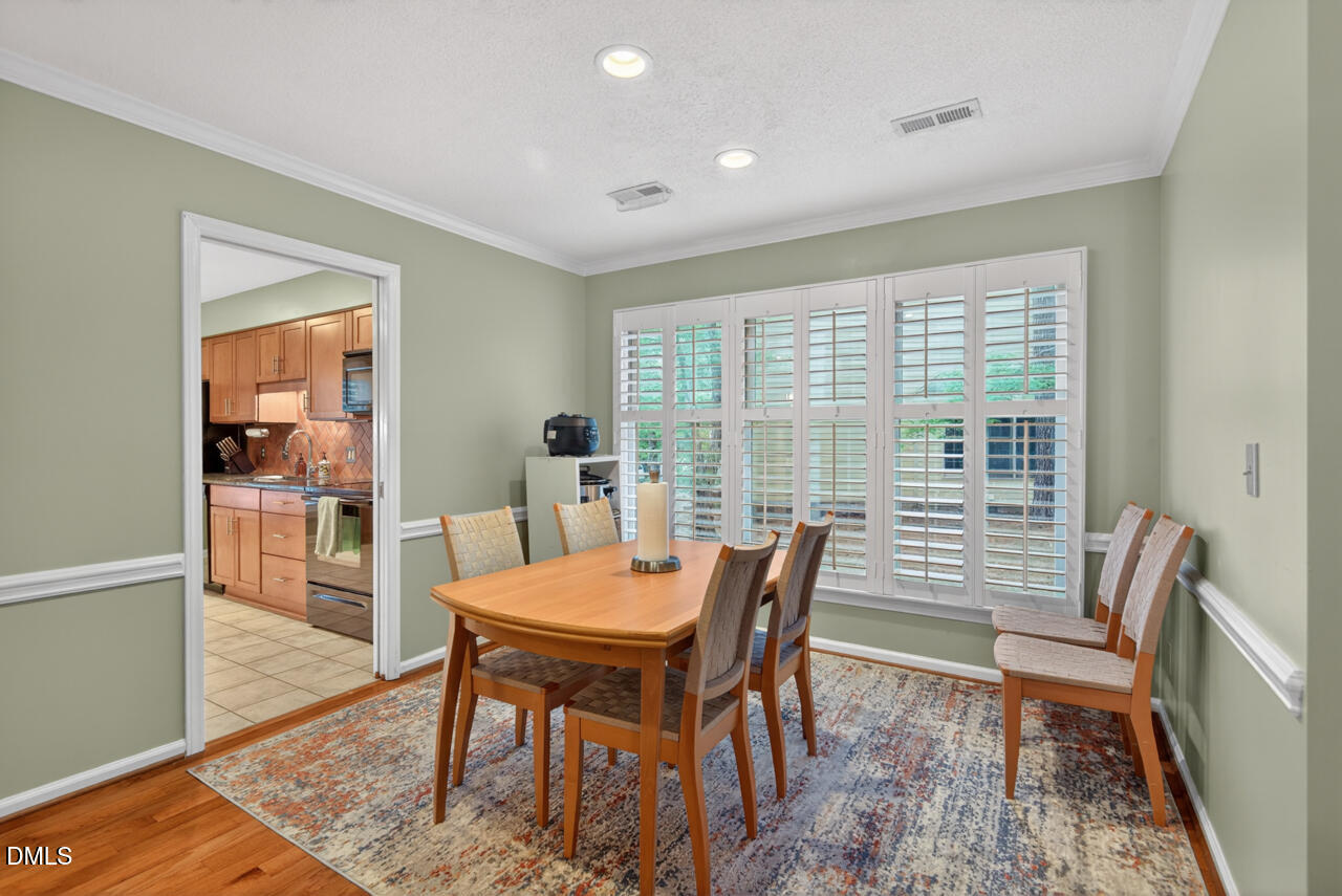 3307 Coachman's Way Durham, NC 27705 - Photo 12 of 50 a view of a dining room with furniture window and wooden floor