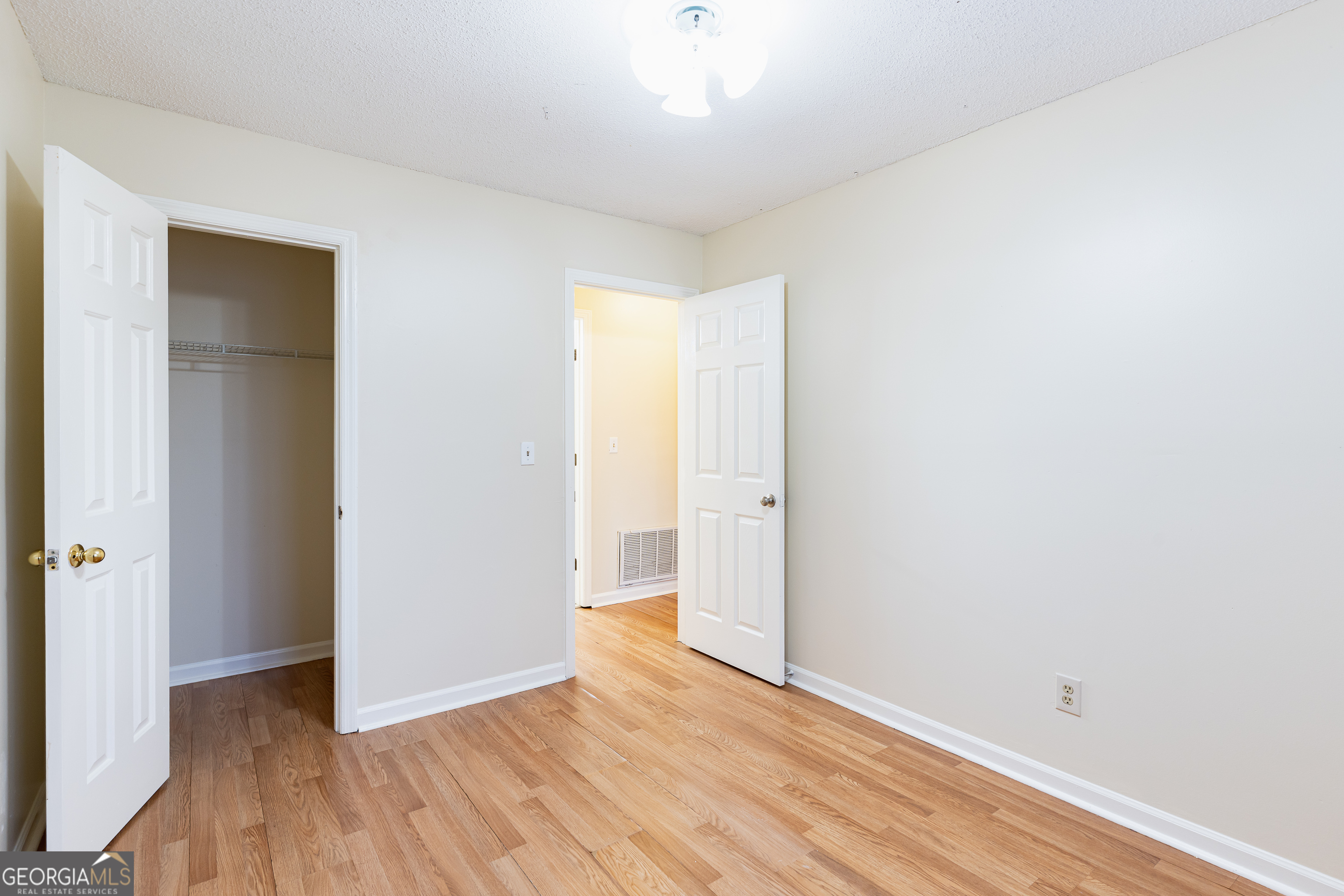 3821 Rex Mill Square Rex, GA 30273 - Photo 23 of 51 a view of an empty room with wooden floor