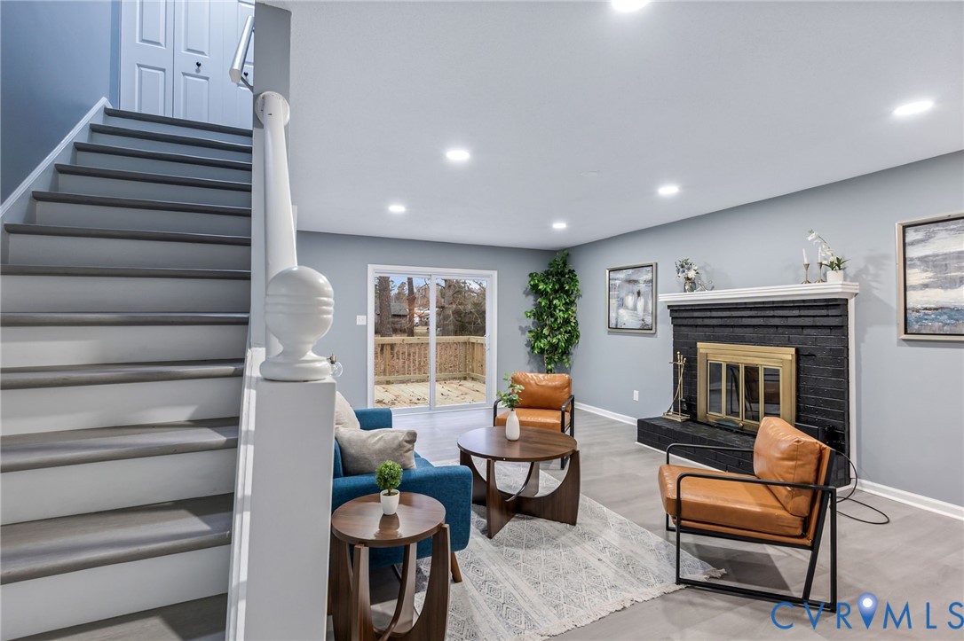 17416 Chemin Road Petersburg, VA 23803 - Photo 14 of 29 a living room with furniture and a fireplace