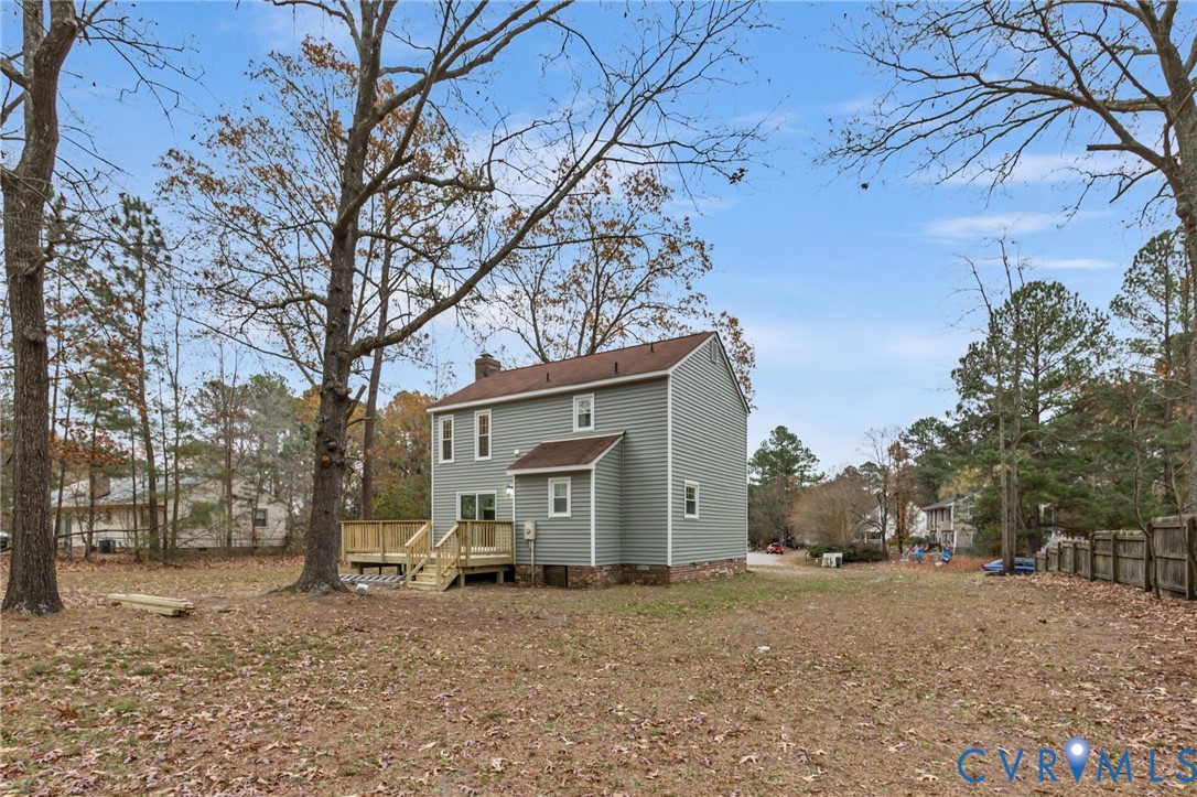 17416 Chemin Road Petersburg, VA 23803 - Photo 28 of 29 a view of a house with a yard and garage