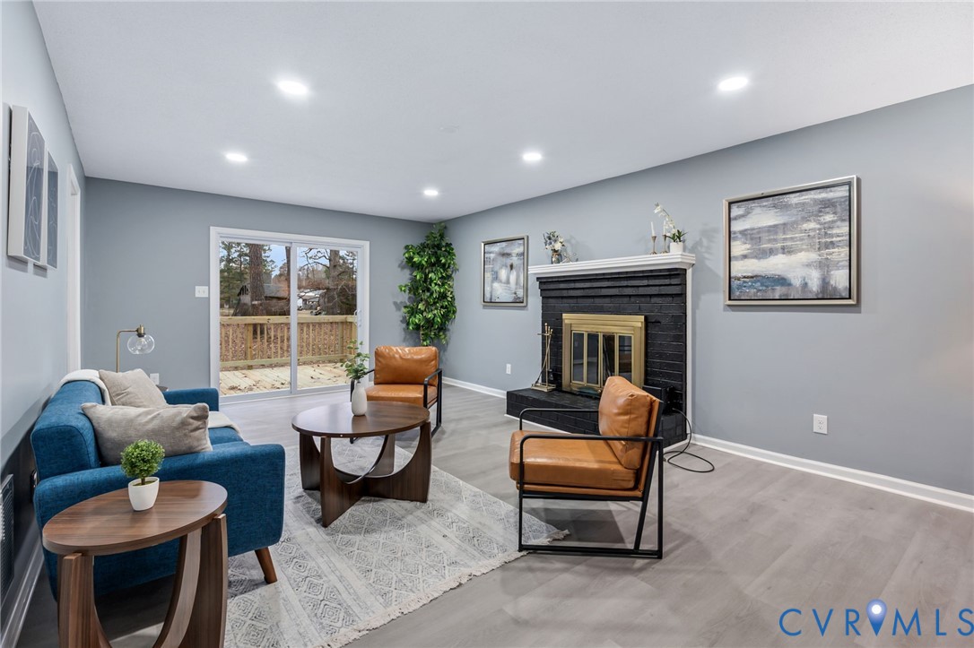 17416 Chemin Road Petersburg, VA 23803 - Photo 5 of 29 a living room with furniture and a fireplace