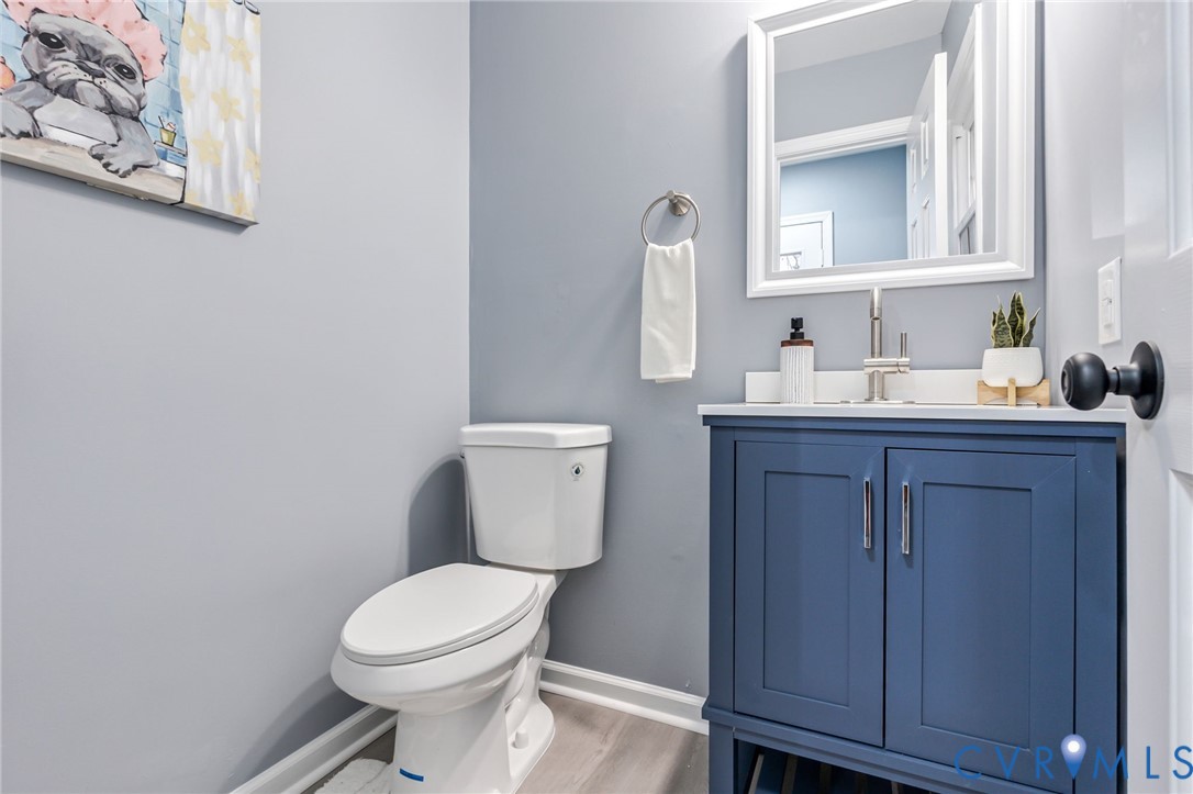 17416 Chemin Road Petersburg, VA 23803 - Photo 9 of 29 a bathroom with a toilet a sink and mirror