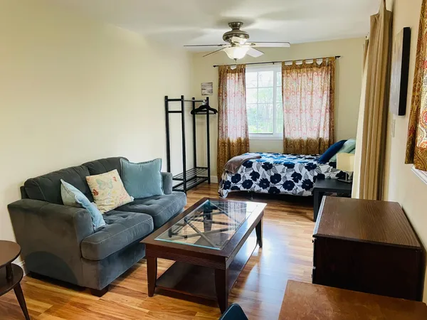 a living room with furniture and a large window