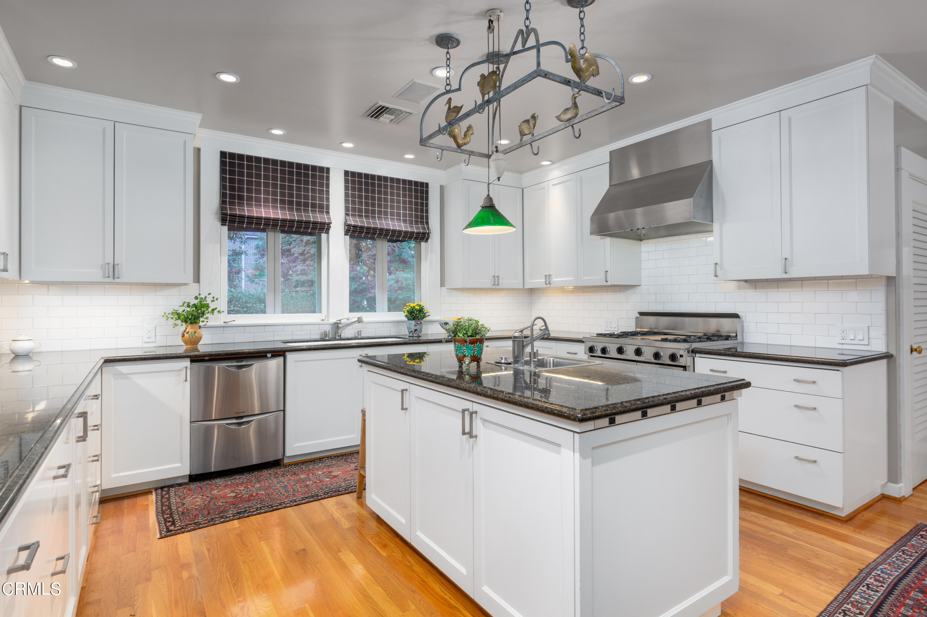 470 Bradford Street Pasadena, CA 91105 - Photo 13 of 75 a kitchen with stainless steel appliances granite countertop a sink a stove and cabinets