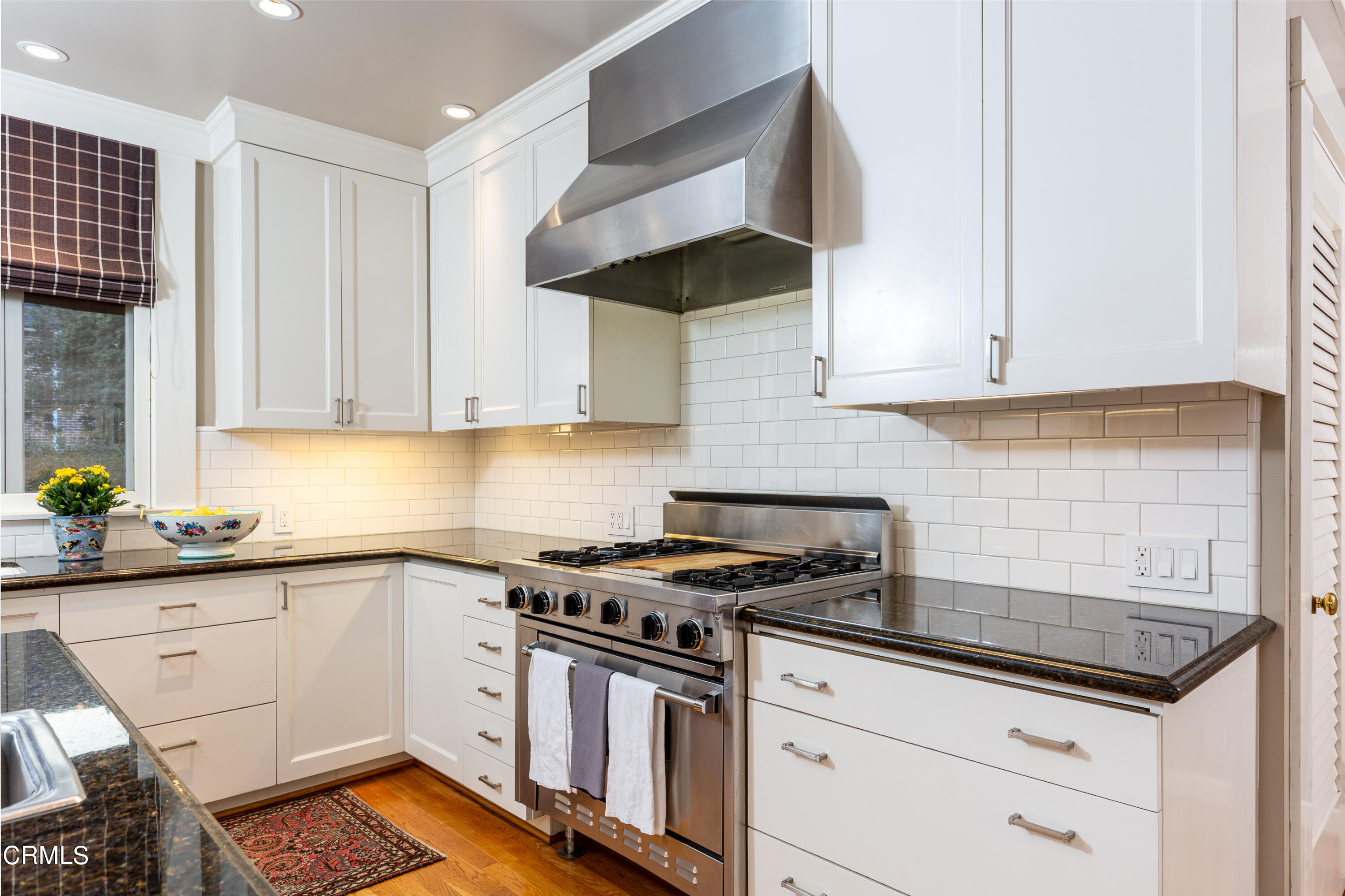 470 Bradford Street Pasadena, CA 91105 - Photo 14 of 75 a kitchen with granite countertop a stove sink and cabinets
