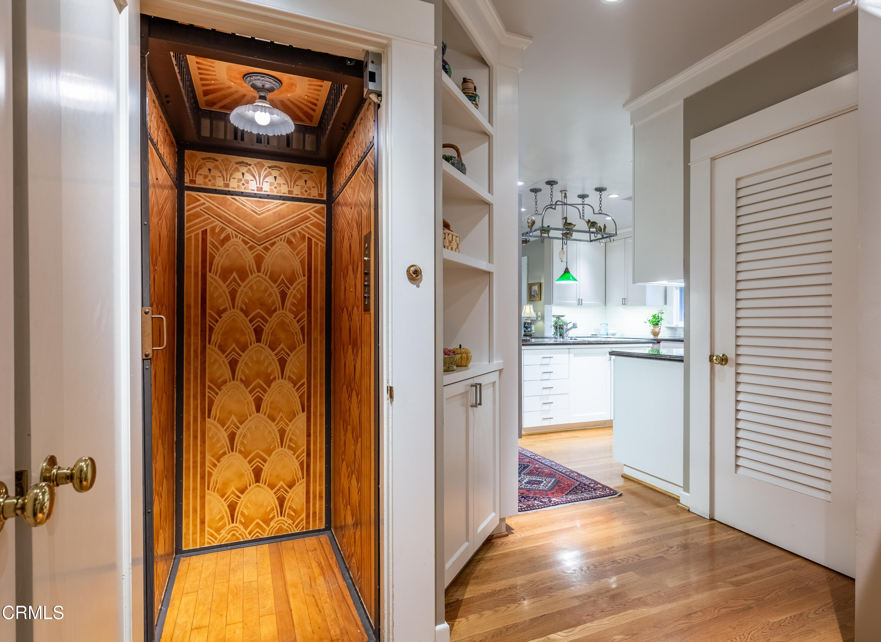 470 Bradford Street Pasadena, CA 91105 - Photo 18 of 75 a view of a hallway with wooden floor and a living room